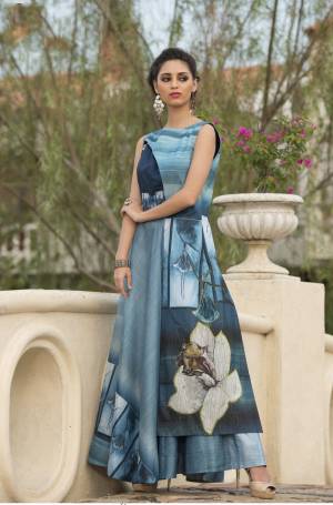 Beautiful Shades In Blue Are Used In This Beautiful Readymade Gown Fabricated On Art Silk. It Is Beautified With Digital Prints All Over. Buy This Gown Now.
