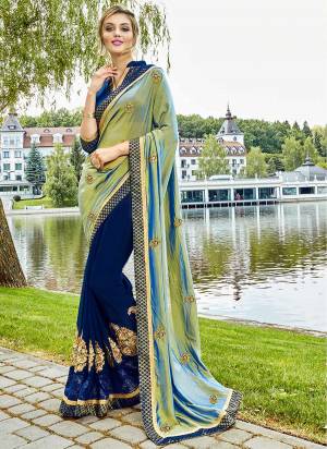 Add This Pretty Saree To Your Wardrobe In Mint Green And Navy Blue Color Paired With Navy Blue Colored Blouse. This Saree IS Silk And Grorgette Based Paired With Art Silk Blouse. Buy This Saree Now.