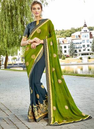 Get Ready For The Upcoming Festive And Wedding Season, Grab This Designer Saree In Green And Dark Grey Color Paired With Dark Grey Colored Blouse. This Saree IS Fabricated On Chiffon And Georgette Paired With Art Silk Fabricated Blouse. Buy This Designer Saree Now.