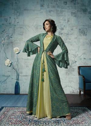 Grab This Designer Readymade Gown With Jacket In Pastel Green And Green Color. Its Is Fabricated On Maslin And Linen Satin Beautified With Prints Over The Jacket And Embroidred Neckline.