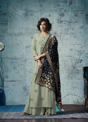 You Will Definitely Earn Lots Of Compliments Wearing This Designer Dress In Pastel Green Color Fabricated On Maslin Silk. Also This Readymade Suit Is Paired With Contrasting Navy Blue Colored Viscose Jacquard Dupatta Adding More Beauty To The Dress, You Can Pair It Up With Same Pastel Green Plazzo Or Leggings.
