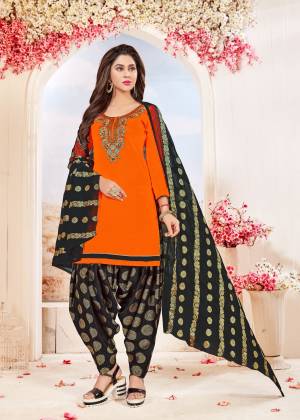 Shien Bright In This Dress Material In Orange Colored Top Paired With Black Colored Bottom And Dupatta. Its Top And Bottom Are Cotton Based Paired With Chiffon Dupatta. Buy Now.