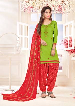 Proper Traditional Combination Is Here With This Dress Material In Green Colored Top Paired With Contrasting Red Colored Bottom And Dupatta. Its Top And Bottom Are Cotton Based Paired With Chiffon Jacquard Dupatta. Buy Now.