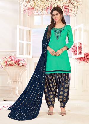 Add Some Casuals With This Dress Material In Sea Green Colored Top Paired With Contrasting Navy Blue Colored Bottom And Dupatta. Get This Stitched As Per Your Regular Fit And Comfort. Buy Now.