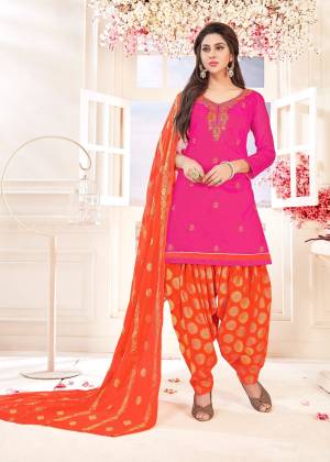 Beat The Heat With This Bright Rani Pink Colored DREss Material Paired With Contrasting Orange Colored Bottom And Dupatta. Its Top And Bottom Are Cotton Based Paired With Chiffon Jacquard Dupatta. 