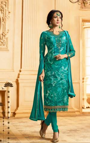 Add This New Shade In blue To Your Wardrobe With This Designer Semi-Stitched Suit In Teal Blue Color Paied With Teal Blue Colored Bottom And Dupatta. Its Top Is Fabricated On Georgette Brasso Paired With Santoon Bottom And Chiffon Dupatta. Buy Now.