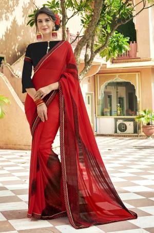 Adorn The Pretty Angelic Look In This Red Colored Saree Paired With Black Colored Blouse. This Saree IS Georgette Based Which Is Durable And Easy To Care For.