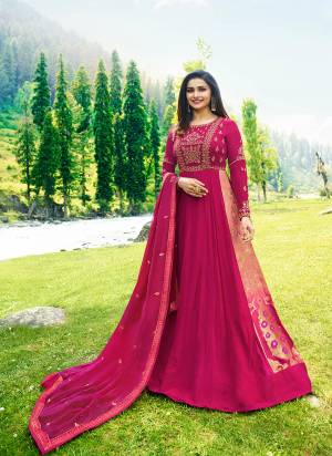 Bright And Visually Appealing Color Is Here With This Designer Floor Length Suit In Rani Pink Color Paired With Rani Pink Colored Bottom And Dupatta. This Will Give An Attractive Look To Your Personality. Buy Now.