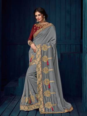 Flaunt a new ethnic look wearing this grey color georgette saree. this party wear saree won't fail to impress everyone around you. this gorgeous saree featuring a beautiful mix of designs. Its attractive color and designer heavy embroidered design, Flower patch design, moti design, beautiful floral design work over the attire & contrast hemline adds to the look. Comes along with a contrast unstitched blouse.