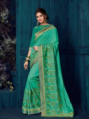 You can get this amazing saree and look pretty like never before. wearing this green color silk saree. this gorgeous saree featuring a beautiful mix of designs. look gorgeous at an upcoming any occasion wearing the saree. Its attractive color and designer heavy embroidered design, Flower patch design, Stone design, beautiful floral design work over the attire & contrast hemline adds to the look. Comes along with a contrast unstitched blouse.