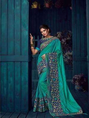 Presenting this peacock green color paper silk saree. look gorgeous at an upcoming any occasion wearing the saree. this party wear saree won't fail to impress everyone around you. Its attractive color and designer heavy embroidered design, Flower patch design, stone design, zari design, beautiful floral design work over the attire & contrast hemline adds to the look. Comes along with a contrast unstitched blouse.