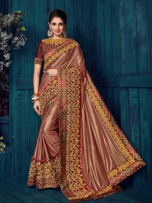 The fabulous pattern makes this brown color glitter lycra saree. Ideal for party, festive & social gatherings. this gorgeous saree featuring a beautiful mix of designs. Its attractive color and designer heavy embroidered design, Flower patch design, moti design, beautiful floral design work over the attire & contrast hemline adds to the look. Comes along with a contrast unstitched blouse.