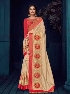 Change your wardrobe and get classier outfits like this gorgeous beige color two tone silk saree. Ideal for party, festive & social gatherings. this gorgeous saree featuring a beautiful mix of designs. Its attractive color and designer heavy golden embroidered design, Flower patch butta design, moti design, beautiful floral design work over the attire & contrast hemline adds to the look. Comes along with a contrast unstitched blouse.