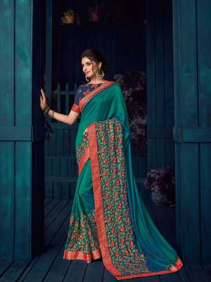 Get this amazing and look pretty like never before. wearing this green color two tone silk saree. Ideal for party, festive & social gatherings. this gorgeous saree featuring a beautiful mix of designs. Its attractive color and designer heavy embroidered design, Flower patch design, stone design, zari work,  beautiful floral design work over the attire & contrast hemline adds to the look. Comes along with a contrast unstitched blouse.