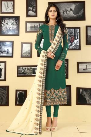 Grab This Designer Semi-Stitched Suit In Green Color Paired With Cream Colored Dupatta. This Straight Cut Designer Suit Is Fabricated On Georgette Paired With Santoon Bottom And Georgette Dupatta. Buy Now.