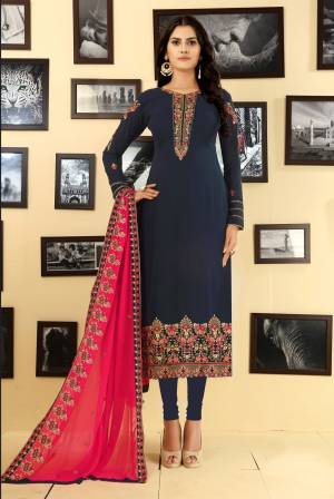 Enhance Your Personality Wearing This Rich and Elegant Looking Designer Straight Suit In Navy Blue Colored Top And Bottom Paired With Contrasting Rani Pink Colored Dupatta. Its Top And Dupatta Are Georgette Fabricated Paired With Santoon Bottom.