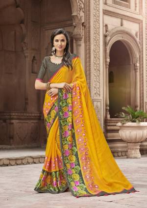 Celebrate this Festive With Bright Color And Comfort, Grab This Very Comfy Yellow Colored Saree Paired With Dark Grey Colored Blouse. This Saree Is Fabricated On Linen Paired With Satin Blouse. Buy This Saree Now.