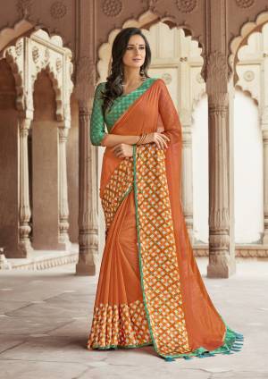 For A Traditional Look, Grab This Saree With Traditional Color Pallete In Orange Color Paired With Contrasting Green colored Blouse. This Saree Is Fabricated On Linen Paired With Satin Blouse. Buy Now.