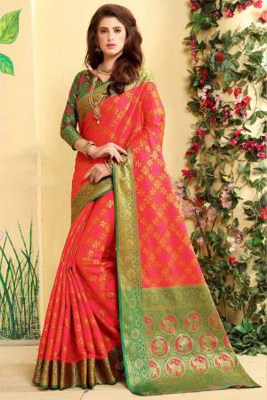 Look Attractive In This Silk Based Saree In Dark Pink Color Paired With Contrasting Dark Green Colored Blouse. This Saree Is Fabricated On Jacquard Silk Paired With Art Silk Blouse. It Is Beautified With Weave All Over.