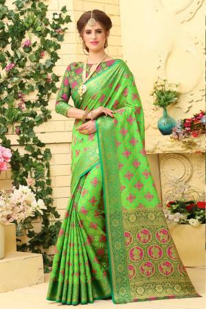Go with the Shades Of Green With This Saree In Light Green Color Paired With Dark Green Colored Blouse. This Saree Is Fabricated On Jacquard Silk Paired With Art Silk Fabricated Blouse. It Has Weave Over It. 