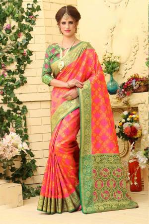 Look Attractive In This Silk Based Saree In Rani Pink Color Paired With Contrasting Green Colored Blouse. This Saree Is Fabricated On Jacquard Silk Paired With Art Silk Blouse. It Is Beautified With Weave All Over.