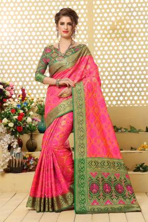 Look Attractive In This Silk Based Saree In Fuschia  Pink Color Paired With Contrasting Green Colored Blouse. This Saree Is Fabricated On Jacquard Silk Paired With Art Silk Blouse. It Is Beautified With Weave All Over.