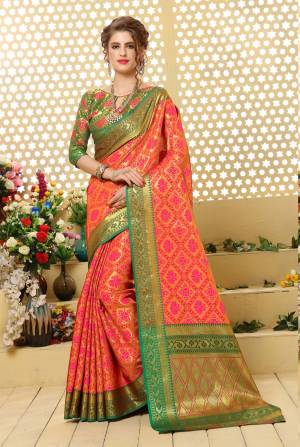 New Shade In Silk Based Saree Is Here With This Saree In Peach Color Paired With Contrasting Green Colored Blouse. This Saree IS Fabricated On Jacquard Silk Paired With Art Silk Fabricated Blouse. It Has Weave All Over IT. 