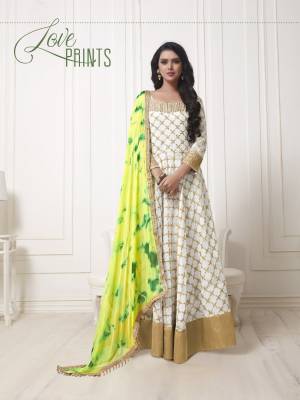 Grab This Designer Floor Length Suit In Off-White Color Paired With Off-White Bottom And Yellow Green Dupatta. Its Top Is Fabricated On Georgette Paired With Santoon Bottom And Chiffon Dupatta. Its Top Has Heavy Embroidery All Over With Printed Attractive Dupatta. Buy Now.