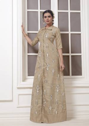 Rich and Elegant looking Designer Floor Length Suit Is Here In Beige Color Paired With Beige Colored Bottom. Its Top Is Khadi Silk Based Fabric Paired With Santoon Bottom. Buy This Now.