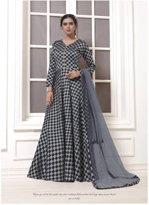 Get Ready For The Upcoming Party With This Designer Floor Length Suit In Grey And Black Color Paired With Black Grey Colored Bottom And Dupatta. It IS Beautified With Checks Prints All Over Its Top.