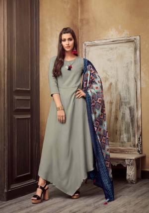 Flaunt Your Rich And Elegant Taste Wearing This Designer Readymade Long Kurti In Grey Color Paired With Contrasting Blue Colored Scarf. This Kurti IS Rayon Based Paired With Muslin Cotton Scarf. Buy This Now.