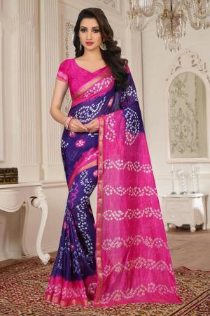 Look Pretty In This Purple And Pink Colored Saree Paired With Pink Colored Blouse. This Saree Is Tafeta Silk Based Paired With Art Silk Fabricated Blouse. It Is Beautified With Bandhani Prints All Over.