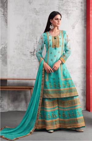Grab This Beautiful Plazzo Suit For This Festive Season In Aqua Blue Color. Its Top And Bottom Are Fabricated On Georgette Paired With Chiffon Dupatta. It Is Beautified With Prints And Thread Work. Buy Now.