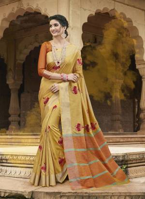 Celebrate This Festive Season Wearing this Pretty Yellow Colored Saree Paired With Contrasting Orange Colored Blouse. This Saree Is Fabricated On Satin Silk Paired With Art Silk Fabricated Blouse. It Is Beautified With Resham Embroidery And Moti Work. 