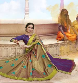 New Shade In Green Is Here With This Pretty Saree In Pear Green Color Paired With Contrasting Purple Colored Blouse. This Saree Is Fabricated On Satin Silk Paired With Art Silk Fabricated Blouse. It Has Contrasting Resham Embroidery With Stone Work