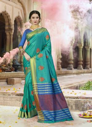 Here Is Beautiful Shade With This Turquoise Blue Colored Saree Paired With Contrasting Blue Colored Blouse. This Saree Is Fabricated On Satin Silk Paired With Art Silk Fabricated Blouse. It Has Contrasting Resham Embroidery With Stone Work.