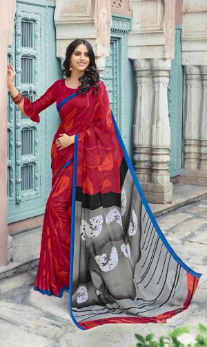 For A Royal Look, Grab This Attractive Saree In Maroon Color Paired With Maroon Colored Blouse. This Saree And Blouse Are Fabricated On Satin Georgette Beautified With Prints All Over It. 