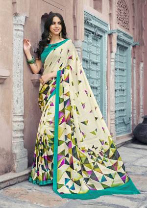 Simple and Elegant Looking Pretty Saree Is Here In Cream Color Paired With Sea Green Colored Blouse. This Saree And Blouse Are Satin Georgette Based Beautified With Geometric Prints All Over It. Buy Now.
