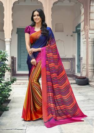 Go Colorful Wearing This Attractive Multi Colored Saree Paired With Dark Pink Colored Blouse. This Saree And Blouse are Fabricated On Satin Georgette Beautified With Lining Prints all Over.