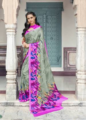 Flaunt Your Rich And Elegant Taste Wearing This Lovely Designer Saree In Grey Color Paired With Contrasting Rani Pink Colored Blouse. This Saree And Blouse Are Fabricated On Satin Georgette Beautified With Prints All Over It.