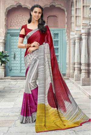 Add This Lovely Saree For Your Semi-Casual Wear In Grey And Red Color Paired With Red Colored Blouse. This Saree And Blouse Are Satin Georgette Based Beautified With Lining Prints All Over It. Buy This Saree Now.
