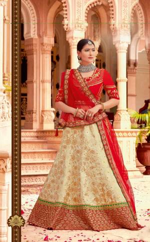 A perfect combination of ethereal charm and glamour, this classic red-and-beige lehenga weaves an old-world romance that?s eternal. Add on to the charm by pairing it with a maharani choker. 