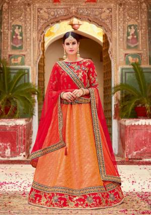 Fall in love with the whiff of elegance in this intricately weaved lehenga contrasted with a bright red hue. Drape the dupatta in a basic free-fall style and exude eternal charm.  