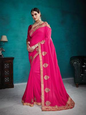 Bright And Visually Appealing Color Is Here With This Designer Saree In Fuschia Pink Color Paired With Fuschia Pink Colored Blouse. This Saree And Blouse Are Art Silk Based Beautified With Jari And Resham Embroidery With Stone Work. 