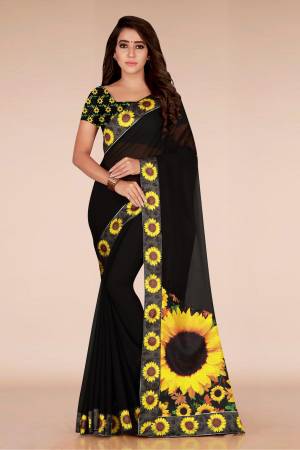 For A Bold And Beautiful Look, Grab This Attractive Floral Printed Saree In Black Color Paired With Black Colored Blouse. This Saree Is Fabricated On Georgette Paired With Art Silk Fabricated Blouse. It Has Bold Sunflower Prints All Over.