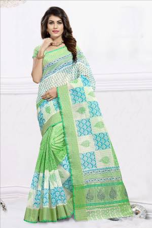 Simple And Elegant Looking Saree Is Here For Your Semi-Casual Wear Is Here In Green and White Color Paired With Green and White Colored Blouse. This Saree And Blouse Are Cotton Based Beautified With Prints All Over It. 