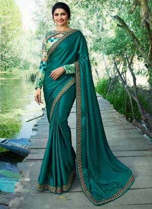 New Shade In Green Is Here To Add Into Your Wardrobe, Grab This Beautiful Designer Saree In Teal Green Color Paired With Light Green Colored Blouse. This Saree Soft Silk Based Paired With Art Silk And Satin Fabricated Blouse. Buy This Saree Now.