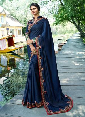 Enhance Your Personality Wearing This Designer Saree In Navy Blue Color Paired With Navy Blue Colored Blouse. This Saree Is Soft Silk Based Fabric Paired With Art Silk And Satin Blouse. It Is Beautified With Prints And Embroider. Buy Now.
