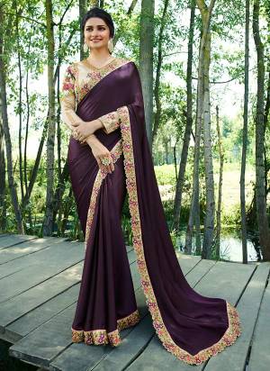 Dark Shades Are Must In Every Womens Wardrobe, So Grab This Designer Saree In Dark Purple Color Paired With Cream Colored Blouse. This Saree Is Fabricated On Soft Silk Paired With Art Silk And Satin Fabricated Blouse. Buy This Designer Saree Now.