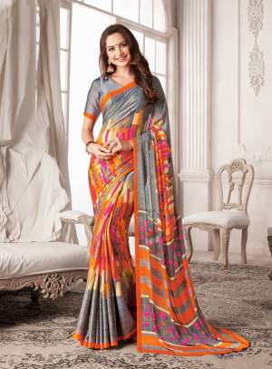 Simple And Elegant Looking Saree Is Here In Grey Color Paired With Grey Colored Blouse. This Saree And Blouse Are Fabricated On Georgette Beautified with Multi Colored Prints. Buy Now.